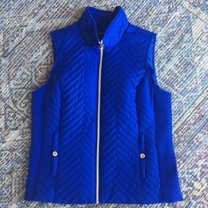 Medium navy blue vest. From “black rivet ”